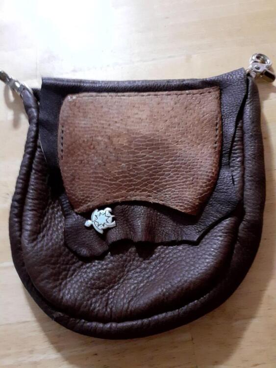 pouch - Buffalo hide pouch with beaver tale on flap. Traditionally sewn by hand